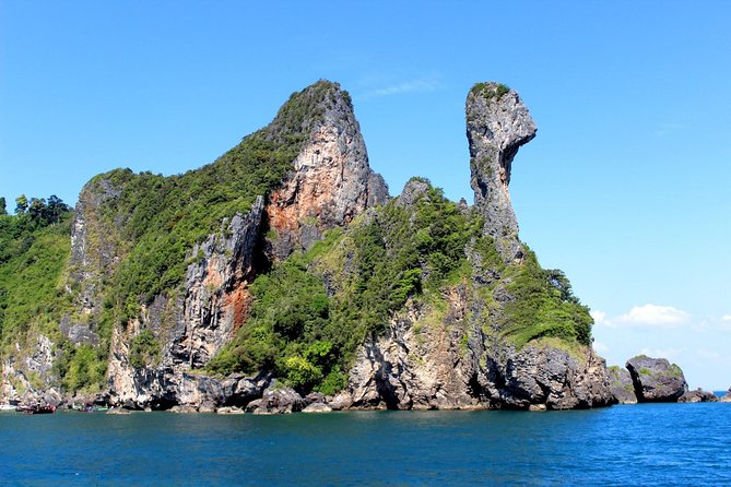 4 Island Tour by Traditional Big Longtail Boat from Krabi - Poda Island: beach time, coral expectations, and how the snorkeling feels