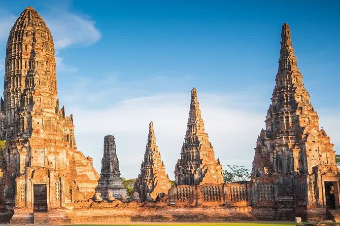Afternoon Ayutthaya heritage site & River Boat Ride at Sunset - Pass-by views from the cruise: Wat Phanan Choeng and the fish-feeding moment