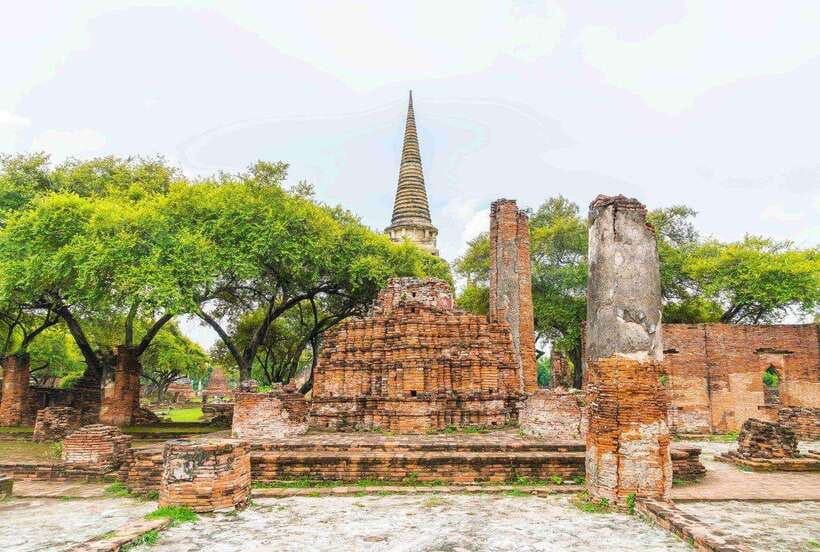 Ayutthaya One Day: Famous Temples & Bang Pa-In Palace Tour - Wat Yai Chai Mongkhon, big chedi energy plus rows of Buddhas
