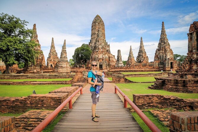 Ayutthaya Sunset Tour: Iconic Temples & Scenic River Boat Ride - Wat Mahathat: the iconic Buddha head in tree roots