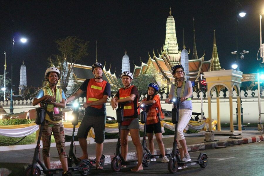 Bangkok: E-Scooter Night Tour with Local Street Food - Wat Arun at night, Santa Cruz Church, and ferry views you actually remember