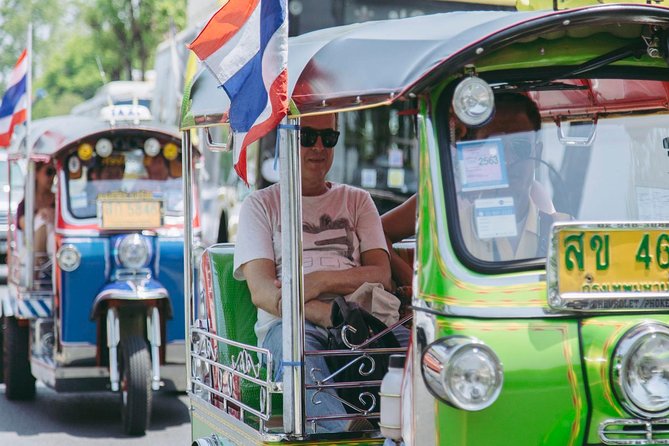 Bangkok Electric Tuk Tuk: Thonburi, Wang Lang & Food Tour - Wang Lang Market food samples, plus that Grand Palace view