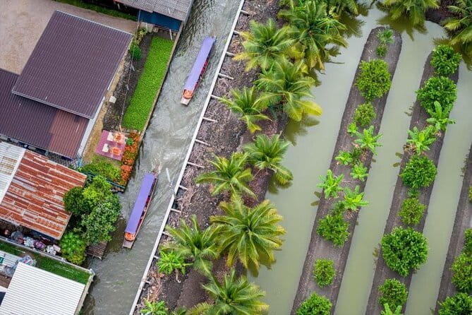 Bangkok: Railway & Damnoen Saduak Floating Market with Transfer - Mae Klong Railway Market: Talad Rom Hoop and the umbrella-shut spectacle