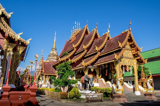 Chiang Mai: Historic Old City Bike Tour - Morning or Night - Wat Inthakhin and the Three Kings Monument Square