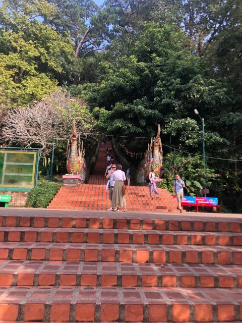 Chiang Mai: Wat Pha Lat & Wat Phra That Doi Suthep Tour - Wat Phra That Doi Suthep: The 306-Step Climb and the Gold Pagoda Moment