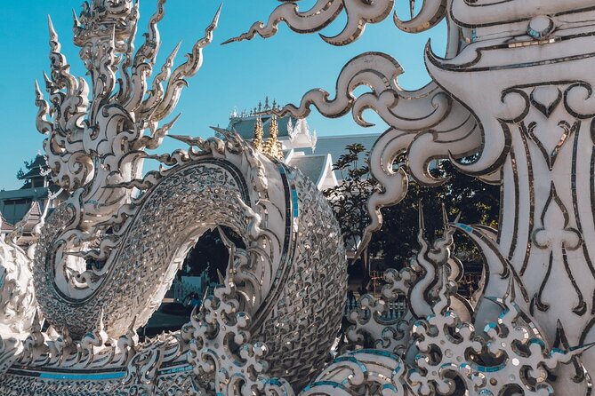 Chiang Rai Famed Temples and Golden Triangle Tour from Chiang Mai - Stop 2: Wat Rong Khun (White Temple) and Its “Modern Faith” Feel