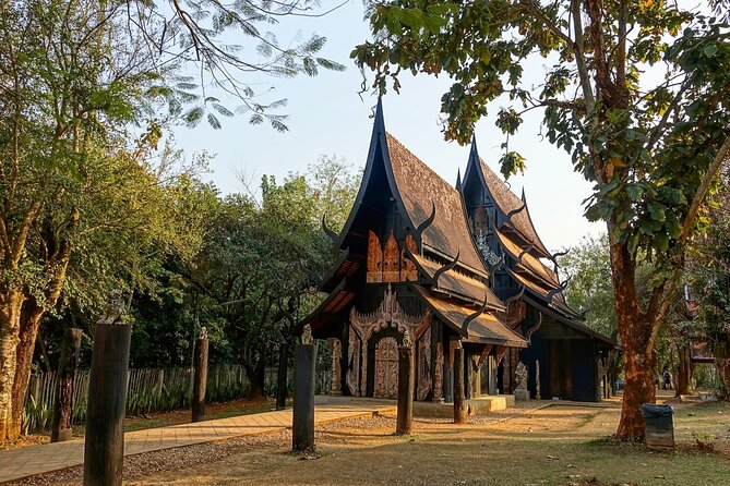 Chiang Rai Famed Temples and Golden Triangle Tour from Chiang Mai - Stop 6: Golden Triangle, Borders, and a Scenic Mekong Boat Ride