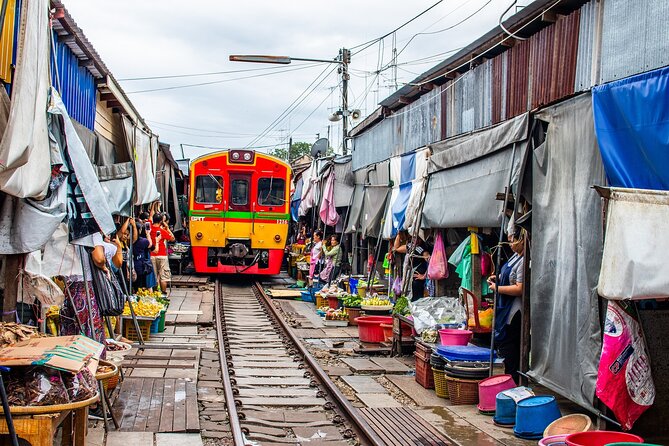 Damnoen Saduak Floating Market and Maeklong Railway Market Tour - Damnoen Saduak on land: shopping, snack breaks, and keeping expectations grounded