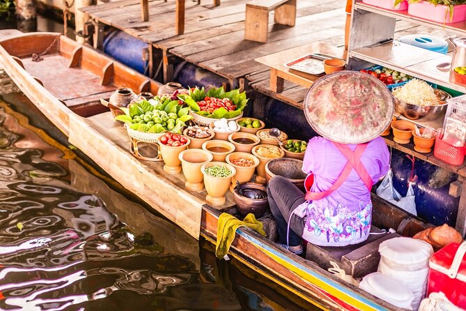 Damnoen Saduak Floating Market and Maeklong Railway Market Tour - Maeklong Railway Market: the umbrella close moment is the headline