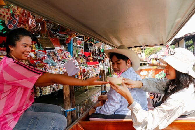 Day Trip to Bangkok Floating Market & Maeklong Railway - Maeklong Railway Market: the train passes, and you notice it right away