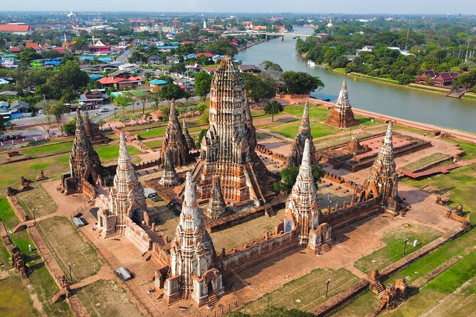 Discover Ayutthaya at Sunset: Historic Temples & River Cruise - Chao Praya sunset boat ride: breeze, temple silhouettes, and photo timing