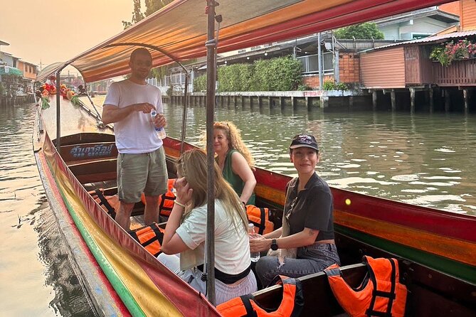 Discover Hidden Bangkok with Longtail Boat Tour - Big Buddha at Wat Paknam from the water: a view with scale