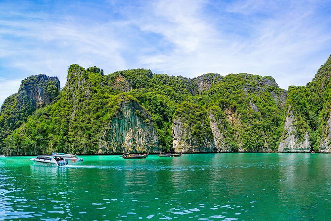 Early Bird Phi Phi and 4 Islands One Day Tour From Krabi - Maya Bay at first light: jungle views and a tightly timed beach stop