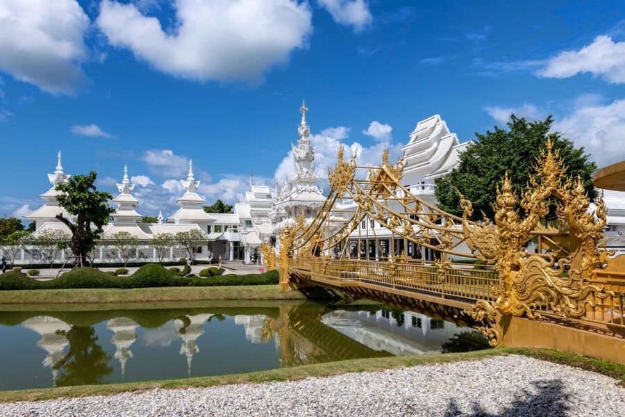 From Chiang Mai: Chiang Rai's Temples Exploration Day Trip - Wat Rong Suea Ten Blue Temple: deep color and tiger legend context