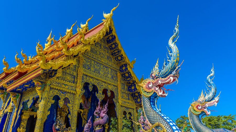 From Chiang Mai: White Temple, Blue Temple & Black House - Wat Rong Suea Ten (Blue Temple): color, sculptures, and a big finish
