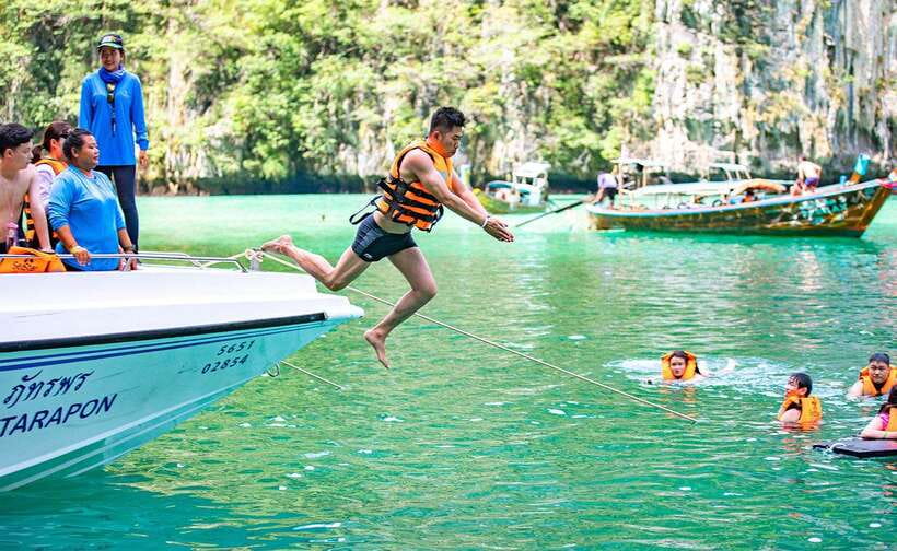 From Krabi: Maya Bay, Bamboo & Phi Phi Islands Day Tour - Maya Bay from Loh Samah Bay: Cliffs, Movie Fame, and Real-Time Crowds