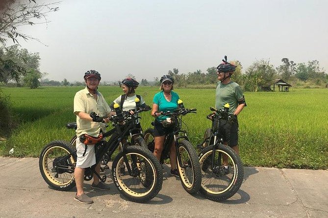 Full-day E-bike Countryside and Nam Phrae (flat-hilly, GUIDED) - The temple and clothing reality: sarong and sun