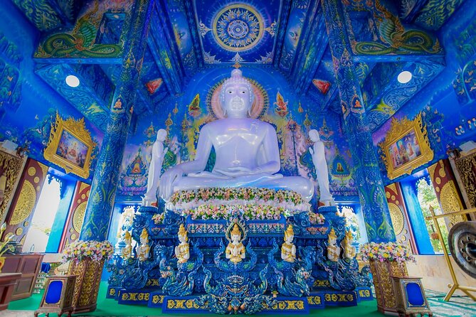Golden Triangle, White, Black, Blue Temple Full Day Tour From Chiang Mai - Wat Rong Suea Ten (Blue Temple): the color payoff and the carvings