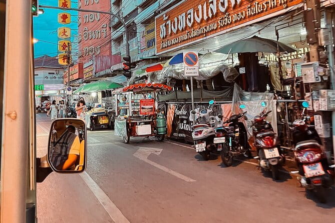 Guided Chiang Mai City Night Tour by EV Tram - Chang Puek Gate and the street-food dinner transition