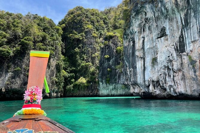 Highlights of Phi Phi Islands - Monkey Bay: clear-water snorkeling, plus the wild monkey rule