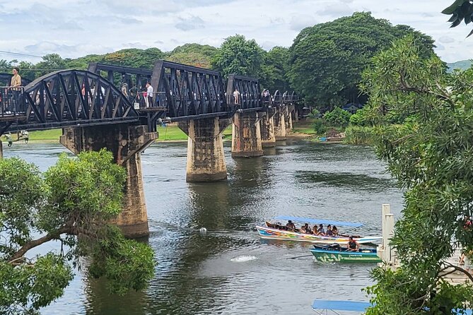 Kanchanaburi Full Day Tour: River Kwai and Erawan Falls - River Khwae Bridge area: walking across history, then using the river ride