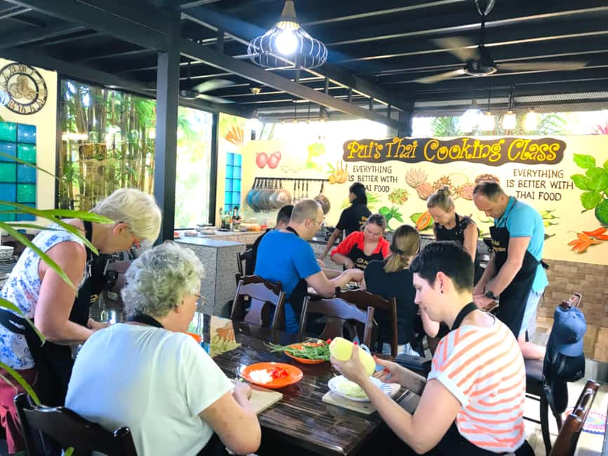 Khao Lak Pui's Authentic Thai Cooking Class - Cooking stations, gas hobs, and a real group feast