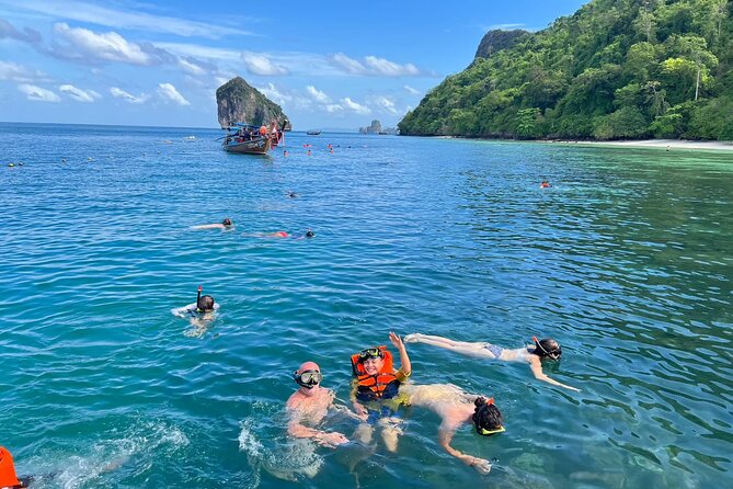 Krabi 7 Islands Snorkeling, Sunset Dinner & Plankton Night - Poda Island sunset BBQ: the meal is part of the show