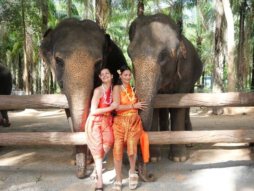 Krabi: Elephant Feeding Program with Traditional Thai Dress - Mahouts and safe boundaries: what respectful feeding feels like
