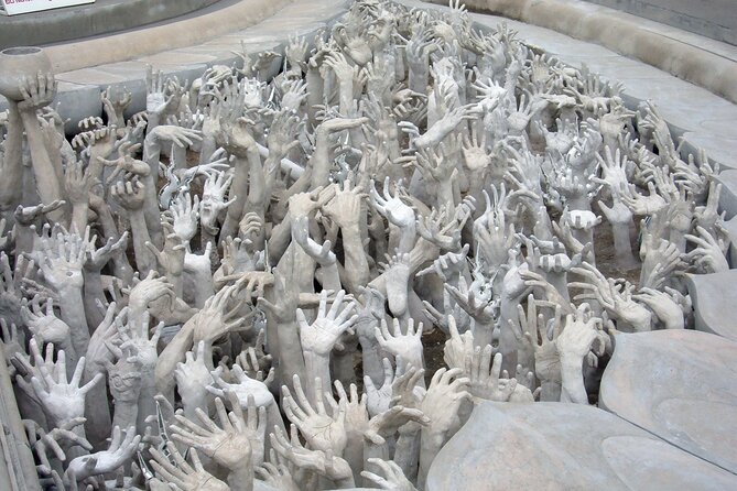 Long Neck Village, White & Blue Temple, Black House Day Tour From Chiang Mai - Wat Rong Seur Ten Blue Temple: carvings that love the camera