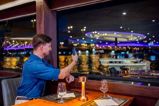 Luxury Dinner Cruise with Guide and Transfer (Opt. Executive Van) - Candlelit dinner cruise format: seafood buffet plus live vocalists and a band