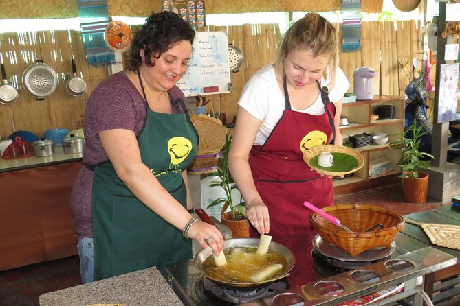 Morning Thai cooking class - The kitchen reality: warm rooms, fans, and serious technique