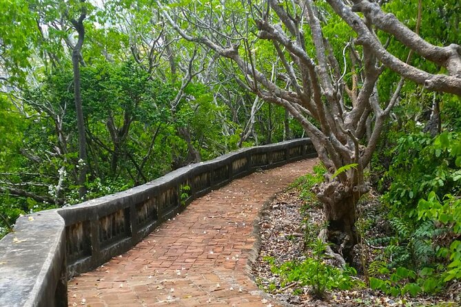 Petchaburi Highlights Khao Luang Cave, Palaces & Temples Group Tour from Hua Hin - Wat Mahathat Worawihan: The White Prang You Can Spot from Afar