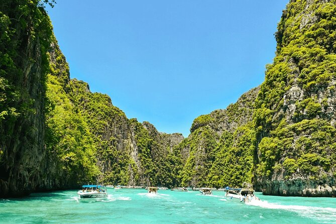 Phi Phi Islands Speedboat Day Trip from Phuket with Lunch - Phi Phi Leh at Phileh Lagoon: swimming in calm water and optional longtail rides