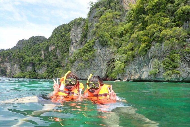 Phi Phi Islands Speedboat Full-Day Tour from Phuket+ Buffet Lunch - Pileh Bay and Green Island: your first snorkeling hour and a limestone show