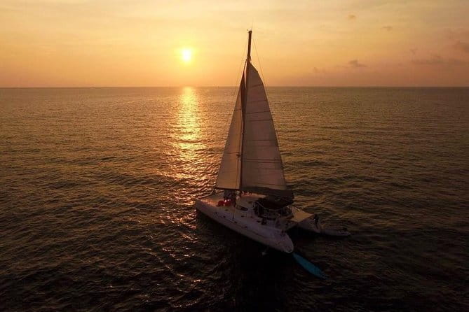 Phuket: Aeolos Catamaran Tour to Coral & Racha Islands + Lunch - Racha Yai: longer beach break, sliding, and crowd reality