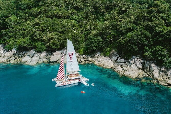 Phuket: Aeolos Catamaran Tour to Coral & Racha Islands + Lunch - Promthep Cape sunset, handline fishing, and that last hour glow