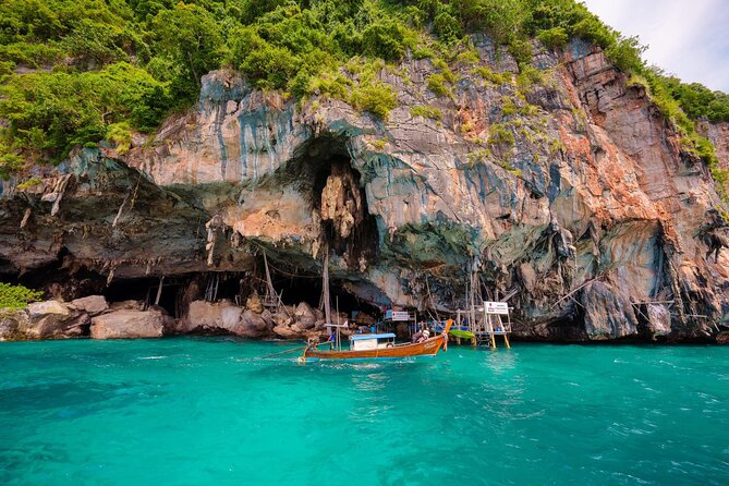 Phuket: Phi Phi Islands, Maya bay & Khai Island Tour by Speedboat - Ko Phi Phi Don: lunch and a decision point for snorkeling