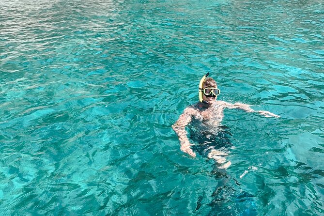 Private Boat Tour with Dolphin Spotting and Snorkelling from Phuket - Coral Island snorkeling: clear water, white sand, and time to breathe