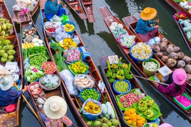Private Damnoen Saduak Floating Market and Train Market Tour - The long-tail boat approach to Damnoen Saduak floating market