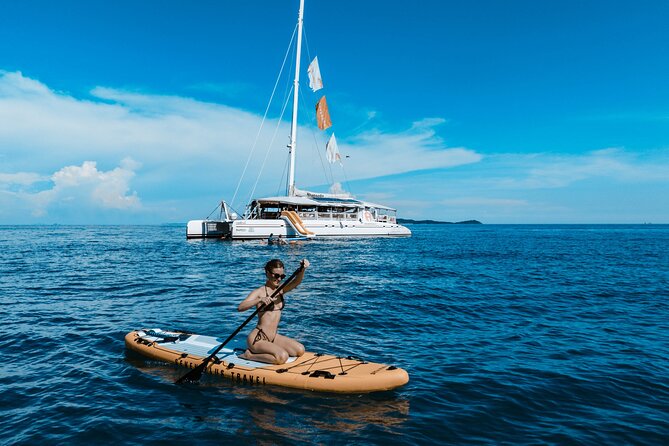 Rhapsody Phuket Coral & Racha Sunset Catamaran Cruise - Racha Yai snorkeling stop, water toys, and what the boat time is really for