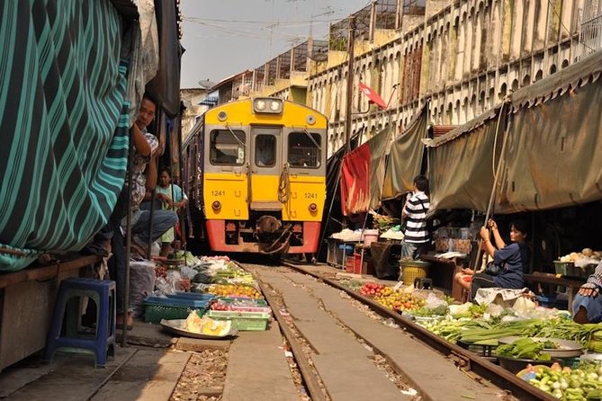 VIP Private Tour Damnoen Saduak+ Amphawa + Mae Klong Railway - Maeklong Railway Market, watching stalls fold before the train arrives